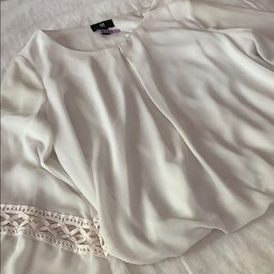 Cream blouse with flared sleeves